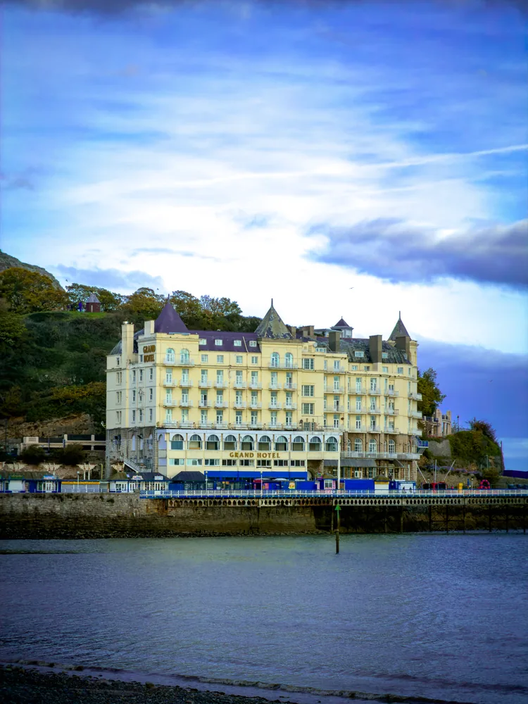 the llandudno seafront photograph follows the coastline and pale buildings across the frame.